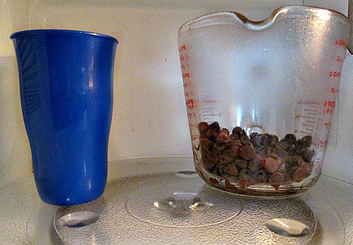 cup and glass cup in microwave. 
