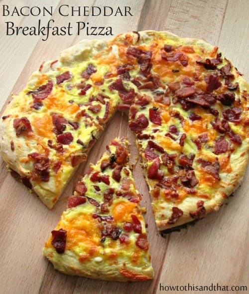 Easy Homemade Bacon Cheddar Breakfast Pizza on cutting board.