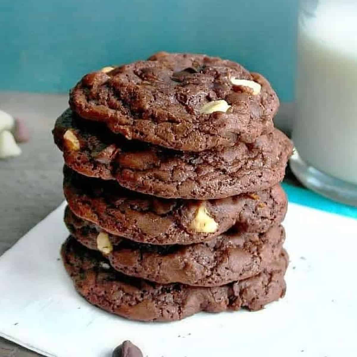 a stack of chocolate cookies with white chocolate chips .