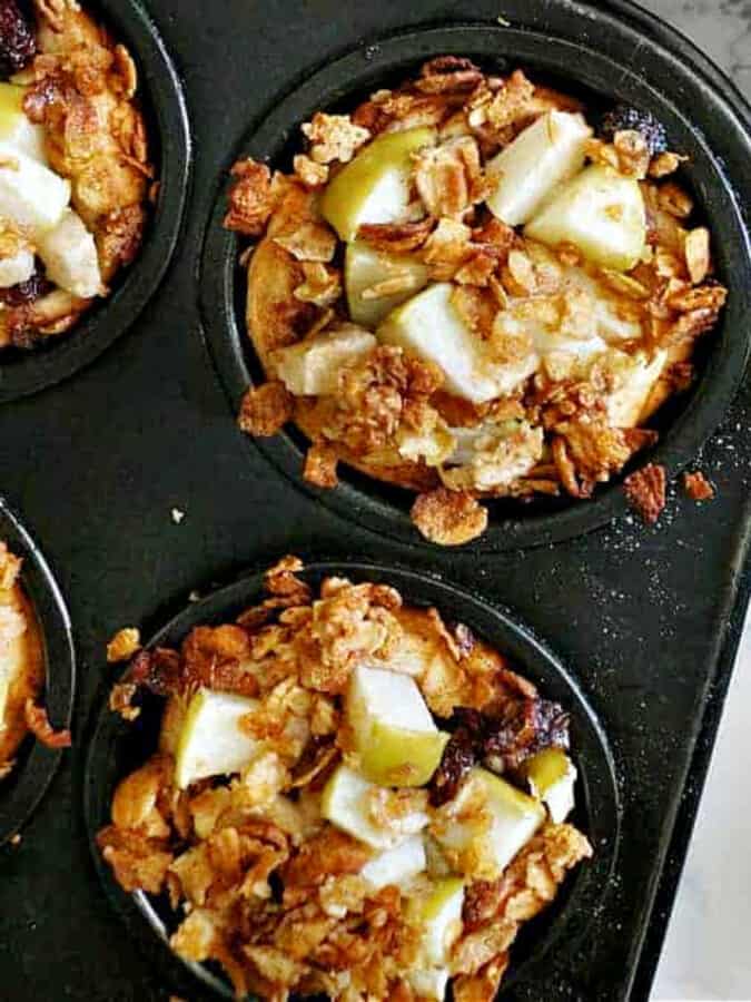 cinnamon roll apple pies in muffin tin. 
