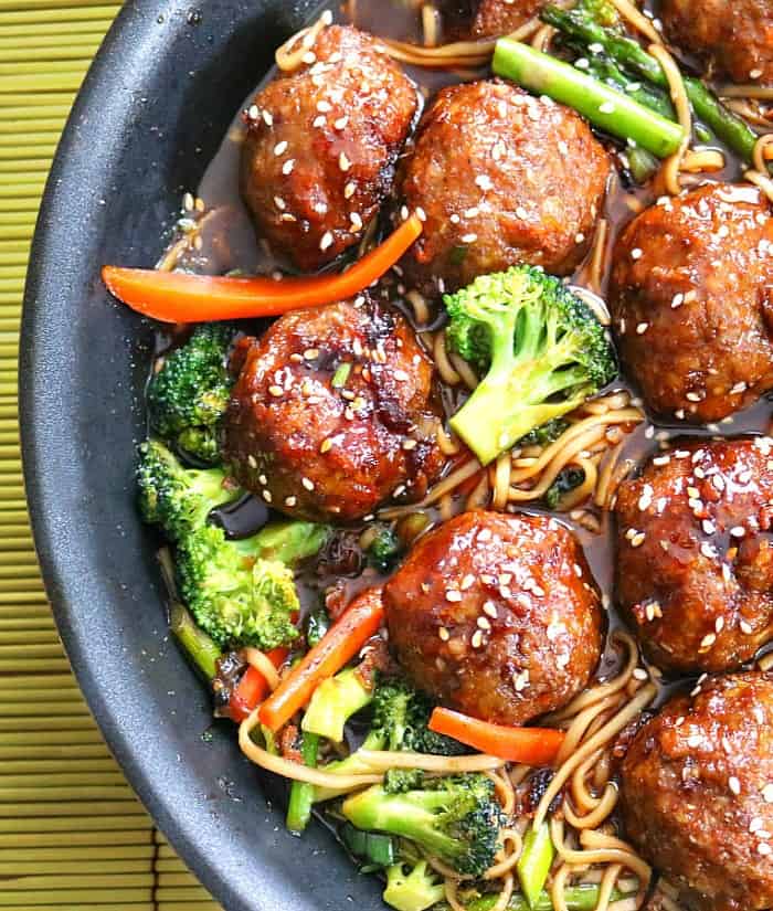 meatballs with lo mein in pan.