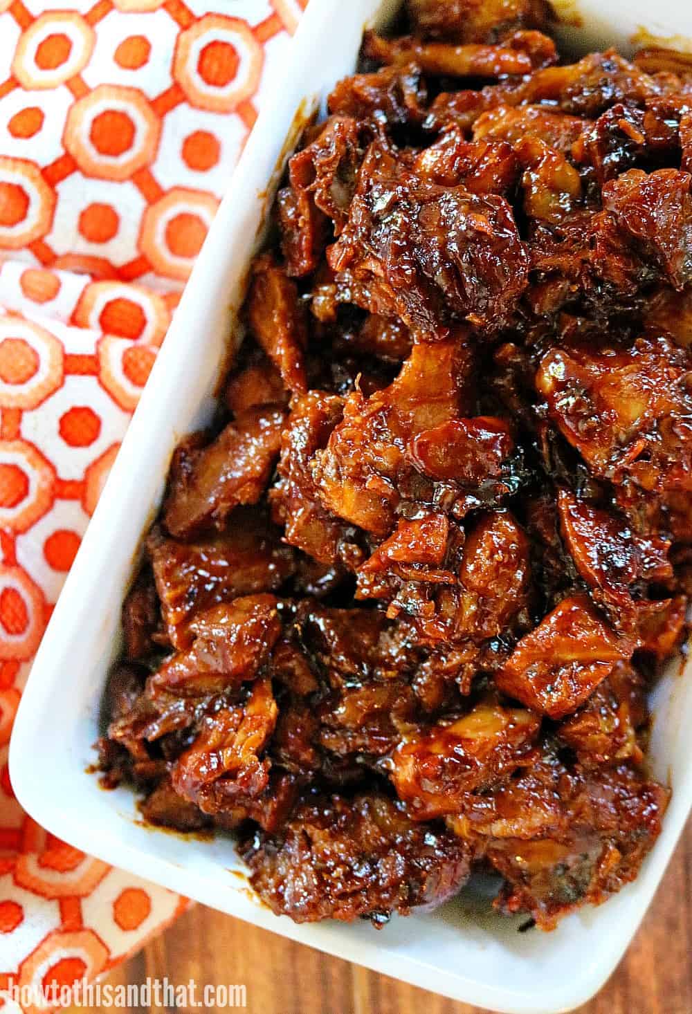 BBQ slow cooker pork on a decorated table.