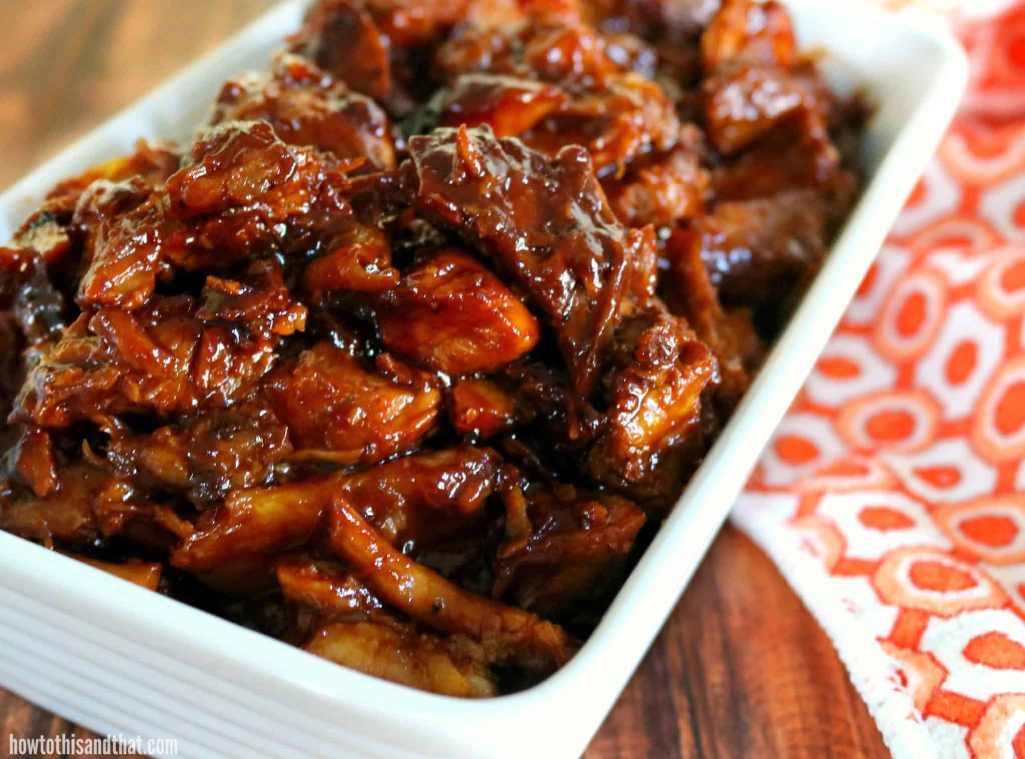 bbq pork pieces in a white dish.