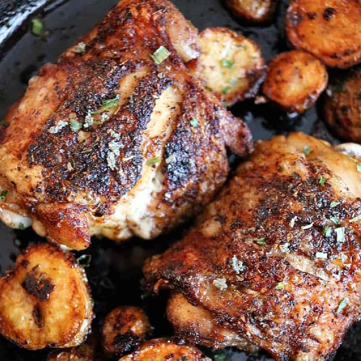 cast iron pan with chicken thighs.