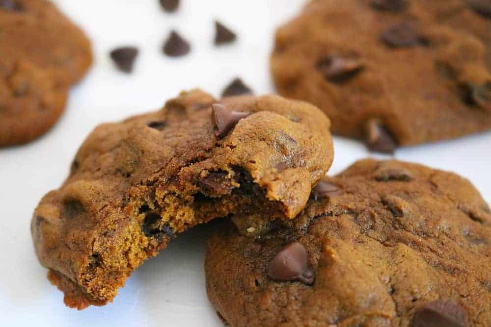 pumpkin chocolate chip cookies on cutting board.