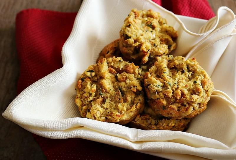 stuffing muffins from a muffin tin in a basket with white napkin. 