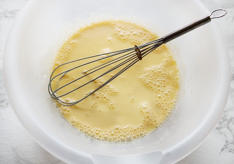 eggs whisked in bowl. 