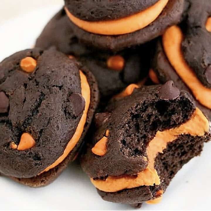 chocolate maine whoopie pies with pumpkin on plate.