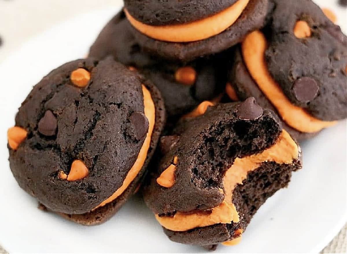 chocolate maine whoopie pies with pumpkin on plate.