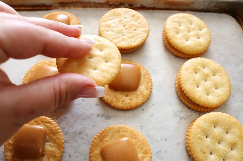 hand putting together crackers. 