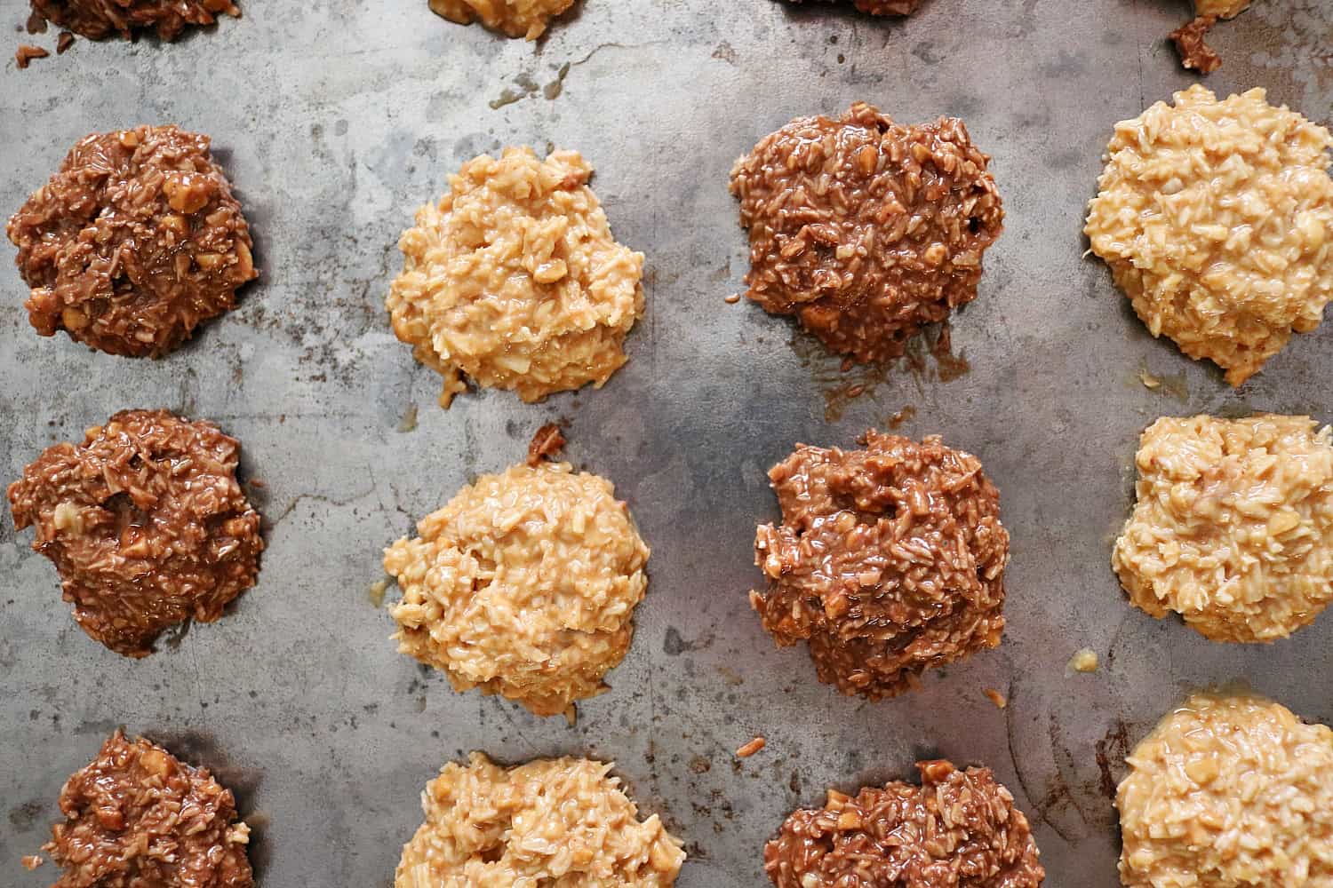 chocolate and peanut butter coconut cookies on a sheet pan. 