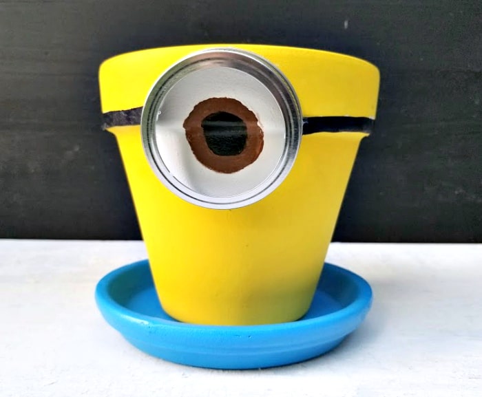 yellow pot painted to look like a minion,