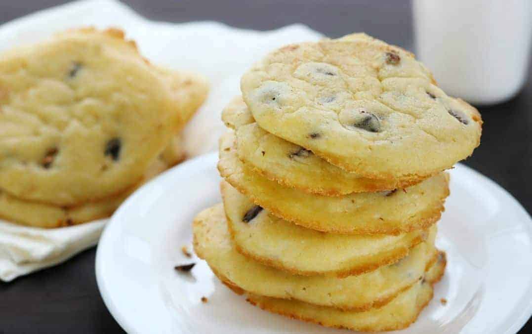 a stack of low carb chocolate chip cookies on a white plate.
