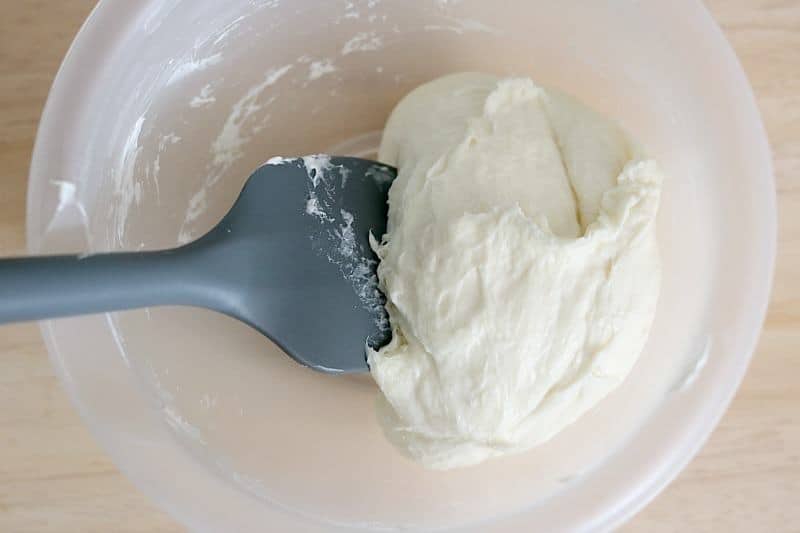 melted mozzarella in bowl with spatula. 