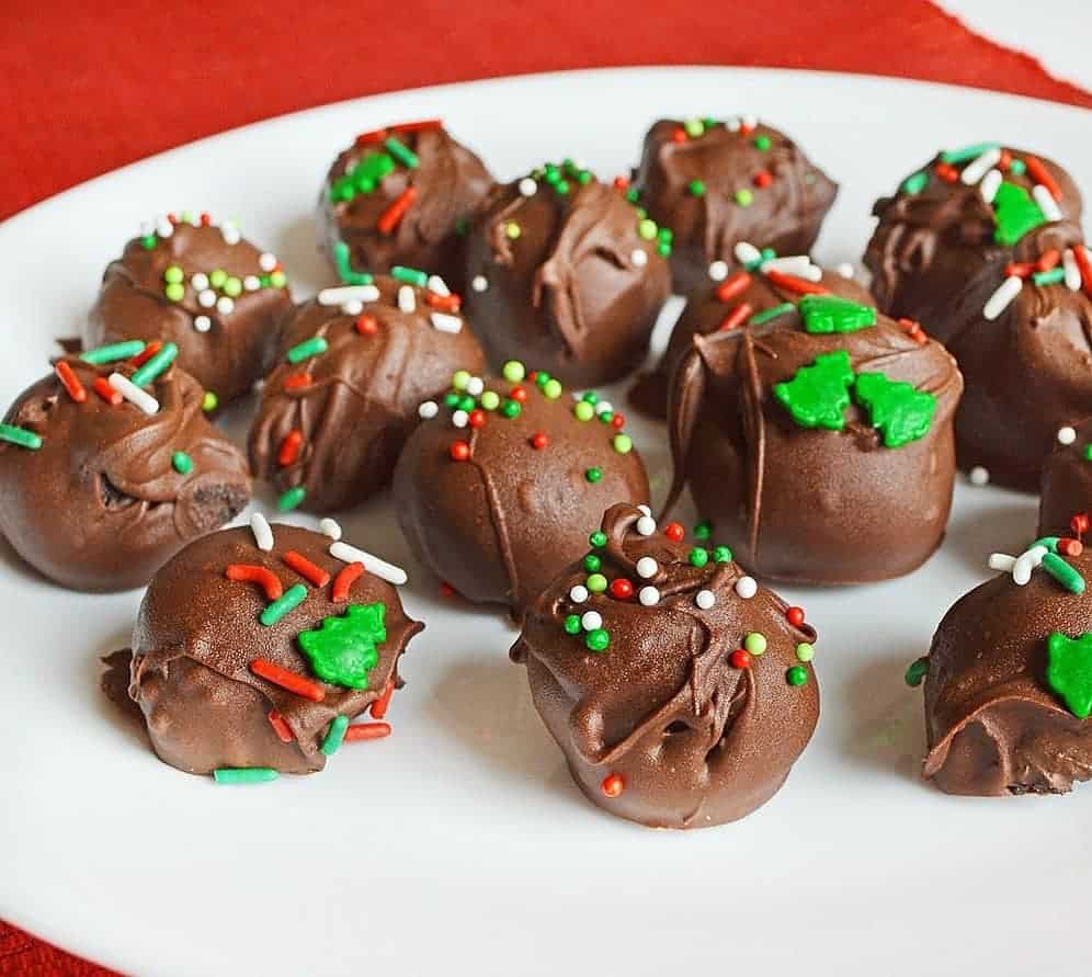 keto chocolate truffles on a plate decorated for holidays. 
