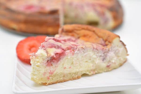 This keto strawberry swirl cheesecake is seriously THE BEST strawberry cheesecake! You can't even tell it's keto so it's perfect for parties. This keto cheesecake is sweet, moist, and full of strawberry flavor. If you're looking for a yummy keto strawberry dessert, you will LOVE this homemade strawberry cheesecake recipe. Just follow the easy step by step directions to make your very own.