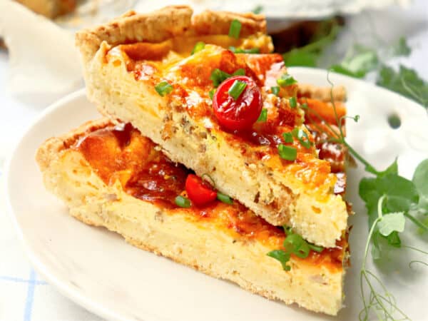 slices of easy bacon quiche on plate.