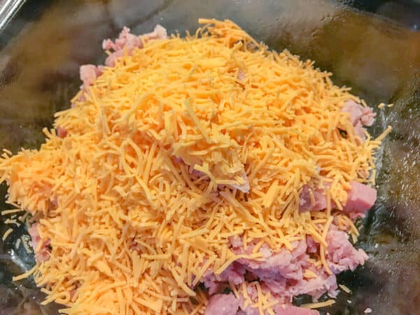 cheddar cheese and ham in bowl.