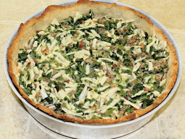 spinach quiche in pie plate.