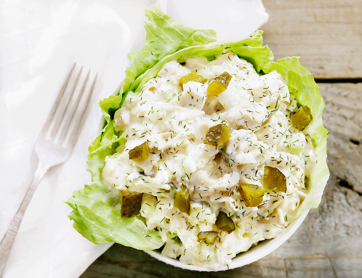 scoop of dill pickle chicken salad in white bowl. 