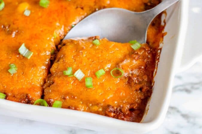 keto ground beef casserole in dish with spoon.