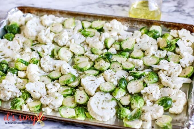 brussels sprouts and cauliflower on a sheet pan.