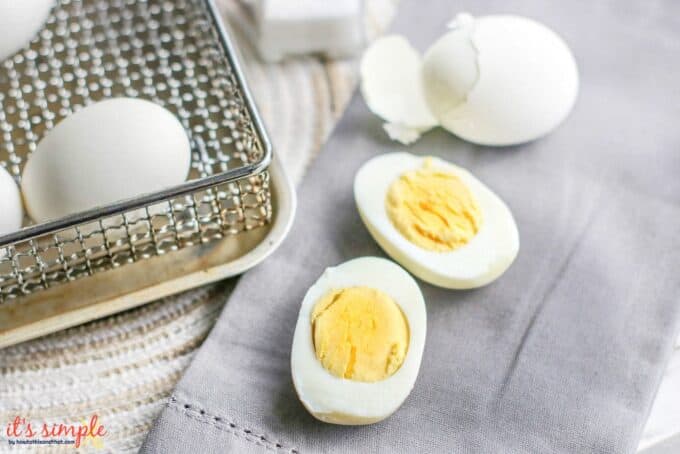 air fryer hard boiled eggs being peeled. 