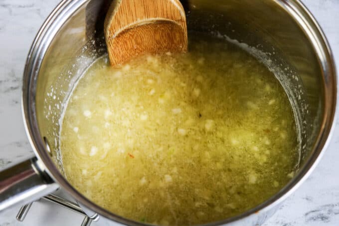 melted butter with garlic in a pot. 
