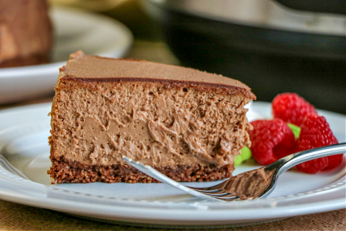 a slice of keto chocolate cheesecake with strawberries. 