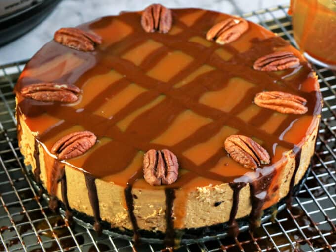 instant pot pumpkin cheesecake cooling on rack. 