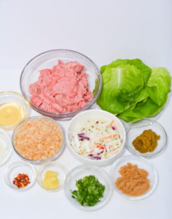Ingredients for lettuce, ground turkey, pork rind crumbs, curry paste, 

