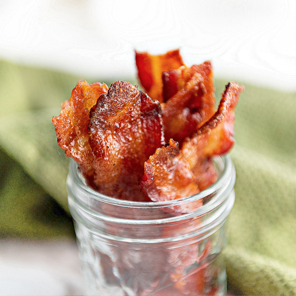 best keto candied bacon slices in mason jar.