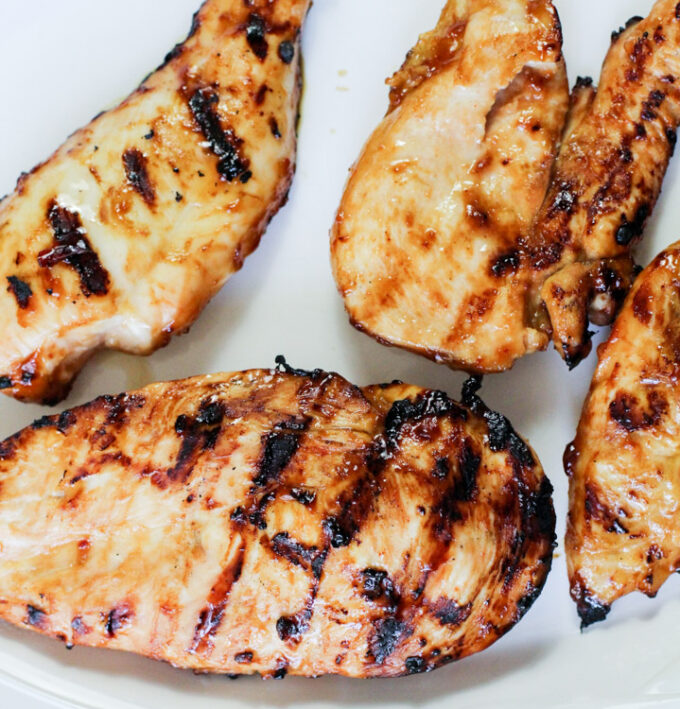 grilled chicken breast on a plate. 