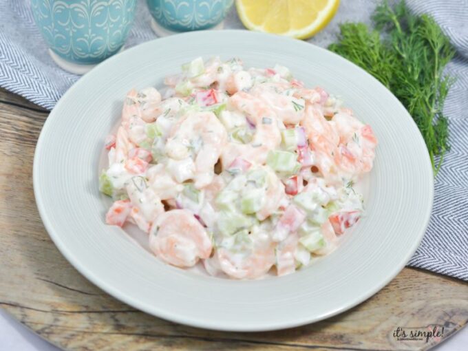 Creamy keto shrimp salad with fresh dill and crunchy vegetables in a white bowl